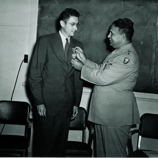 Professor Kennedy receiving Medal of Merit