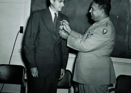 Professor Kennedy receiving Medal of Merit