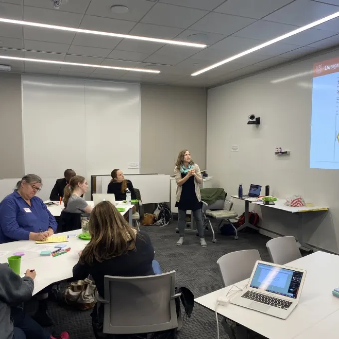K-12 Climate Across Curriculum Program Coordinator Alex Morales-Heil talks to teachers from the St. Louis region about how they can discuss climate change in the classroom. Photo: Washington University Climate Change Program